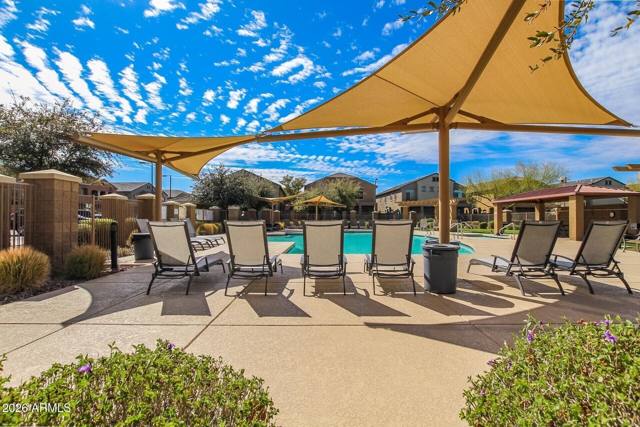Heated community pool with shade sails