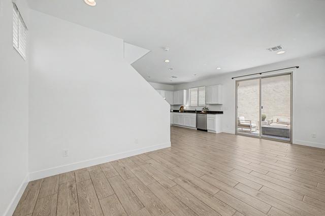 Open living area with wood-look tile