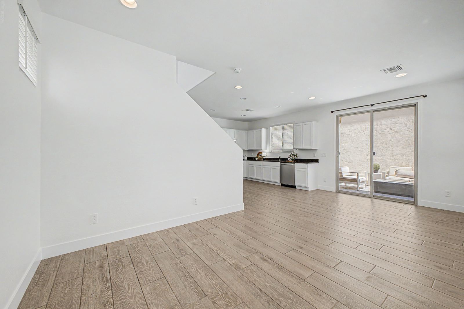 Open living area with wood-look tile