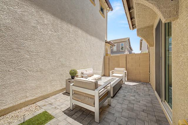 Paver patio with outdoor sofa and chairs