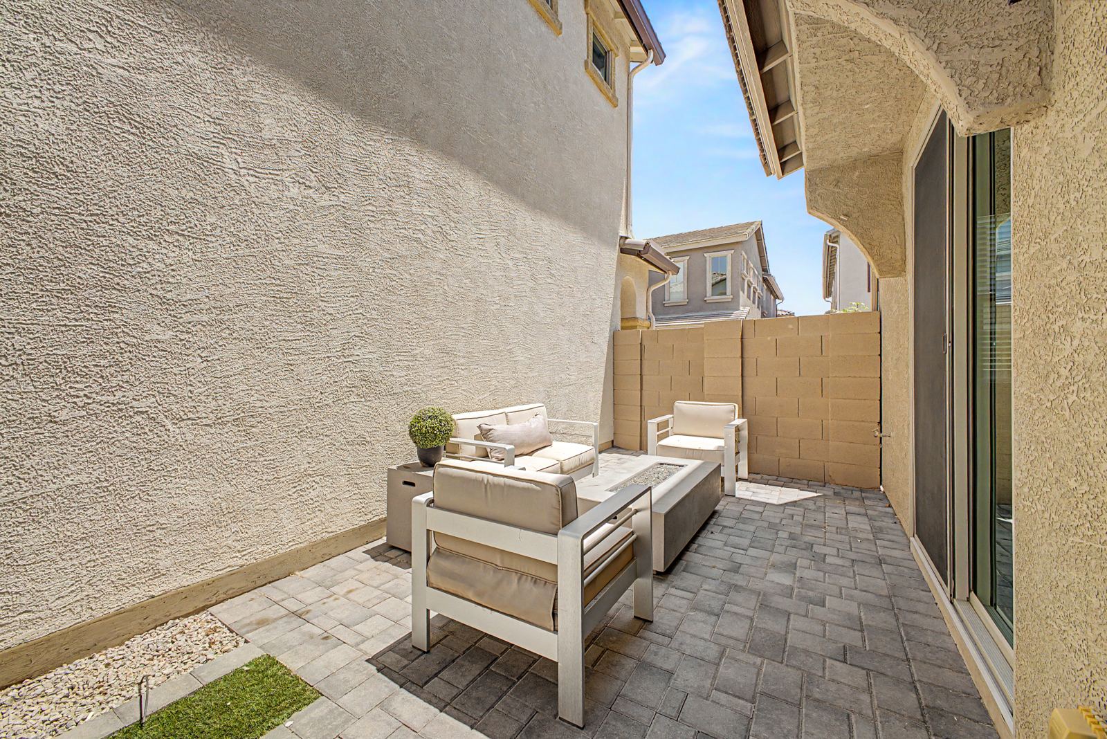 Paver patio with outdoor sofa and chairs