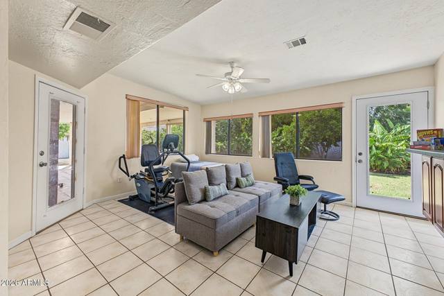 Arizona room with tile floor and exterior doors