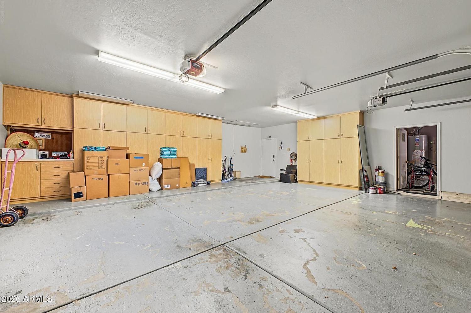 Interior of the three-car garage with storage cabinets