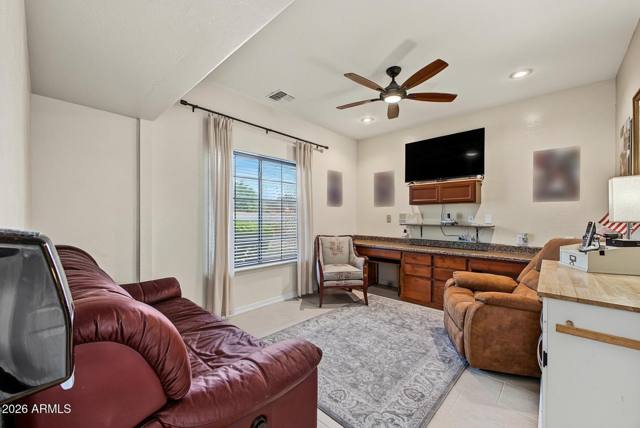 Home office with built-in desk and cabinetry