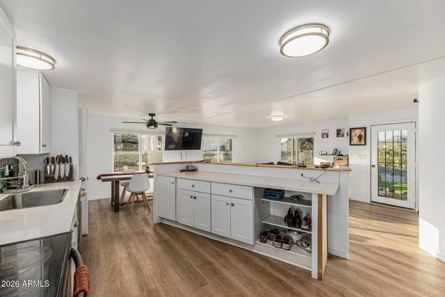 Inside the guest house: kitchen, living and the sunroom door