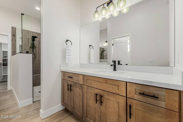 Double vanity and a private toilet room