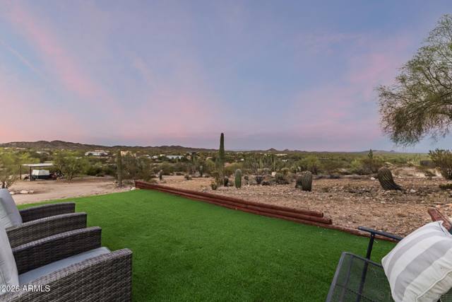 Turf play yard, with the desert picking up where it ends